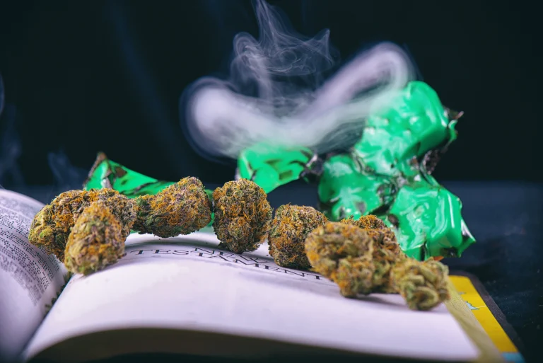Green Crack strain on a book with green blocks behind it